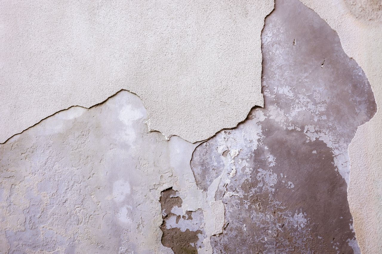 Services Close-up of a weathered and cracked wall with texture and detail.